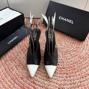 CHANEL 26S POINTED TOE HIGH HEEL SLINGBACKS IN BLACK AND WHITE LAMBSKIN WITH FLORAL APPLIQUE