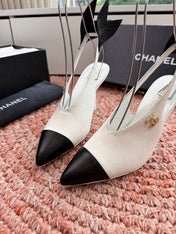 CHANEL 26S POINTED TOE HIGH HEEL SLINGBACKS IN WHITE LAMBSKIN WITH BLACK FLORAL APPLIQUE