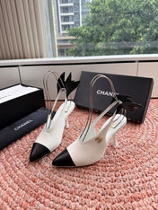 CHANEL 26S POINTED TOE HIGH HEEL SLINGBACKS IN WHITE LAMBSKIN WITH BLACK FLORAL APPLIQUE