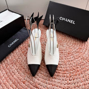 CHANEL 26S POINTED TOE HIGH HEEL SLINGBACKS IN WHITE LAMBSKIN WITH BLACK FLORAL APPLIQUE