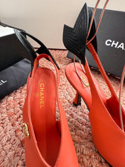 CHANEL 26S POINTED TOE HIGH HEEL SLINGBACKS IN ORANGE LAMBSKIN WITH BLACK FLORAL APPLIQUE