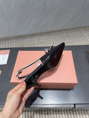 MIUMIU 26S SLINGBACK 55MM IN BLACK AND WHITE CALFSKIN WITH BOW
