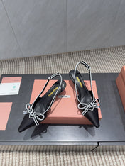 MIUMIU 26S SLINGBACK 55MM IN BLACK AND WHITE CALFSKIN WITH BOW