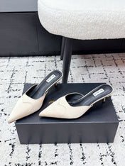 ALAIA 26S HEELED MULES 65 MM IN IVORY BEIGE SATIN