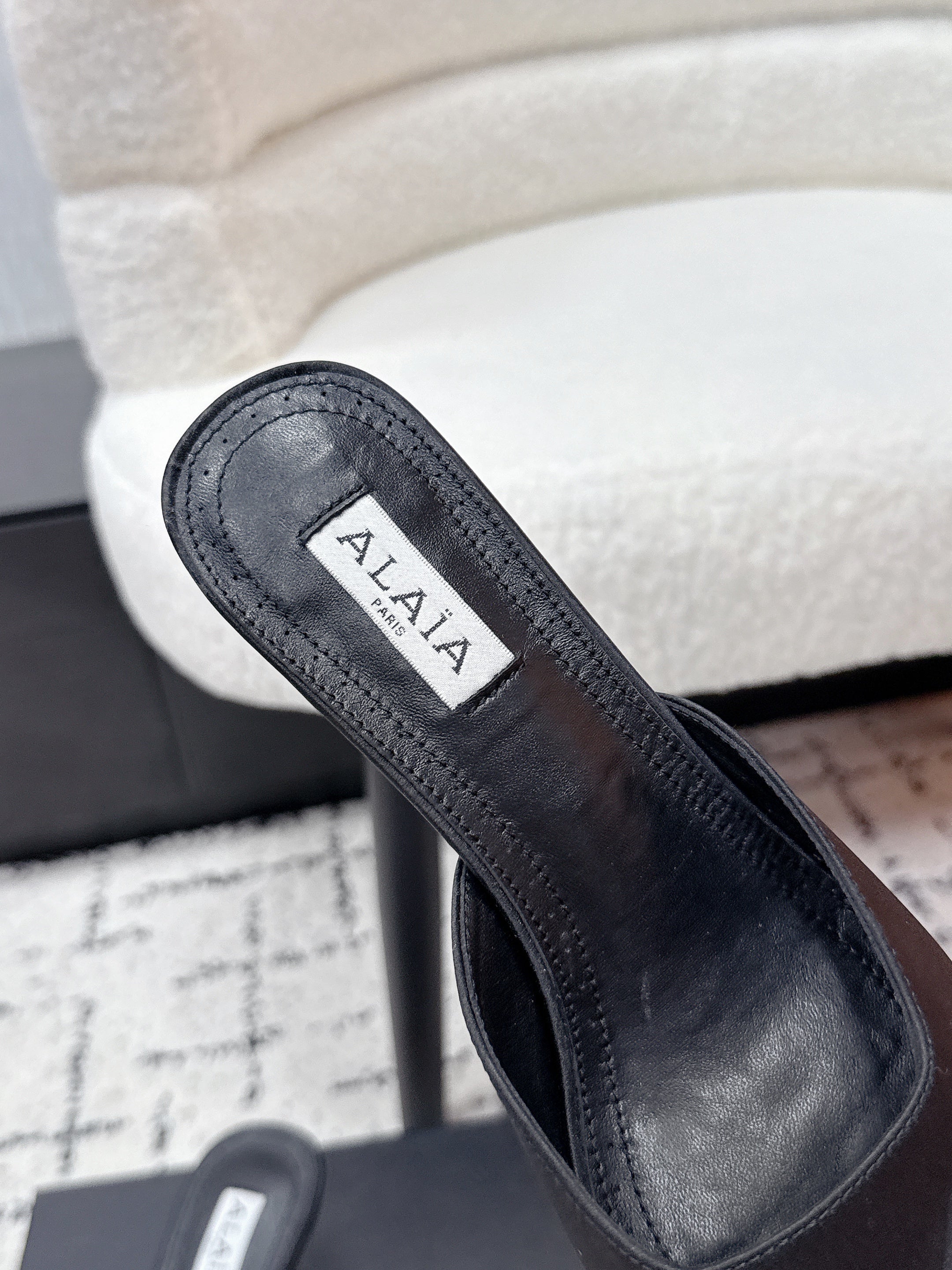 ALAIA 26S HEELED MULES 65 MM IN BLACK SATIN