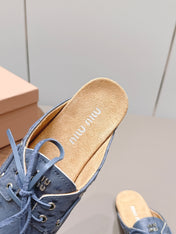 MIUMIU 26S LOAFER MULES IN BLUE CALFSKIN