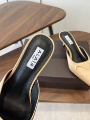 ALAIA 26S HEELED MULES 50 MM IN WARM BEIGE FABRIC