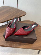 ALAIA 26S HEELED MULES 50 MM IN DARK RED GLOSSY CALFSKIN