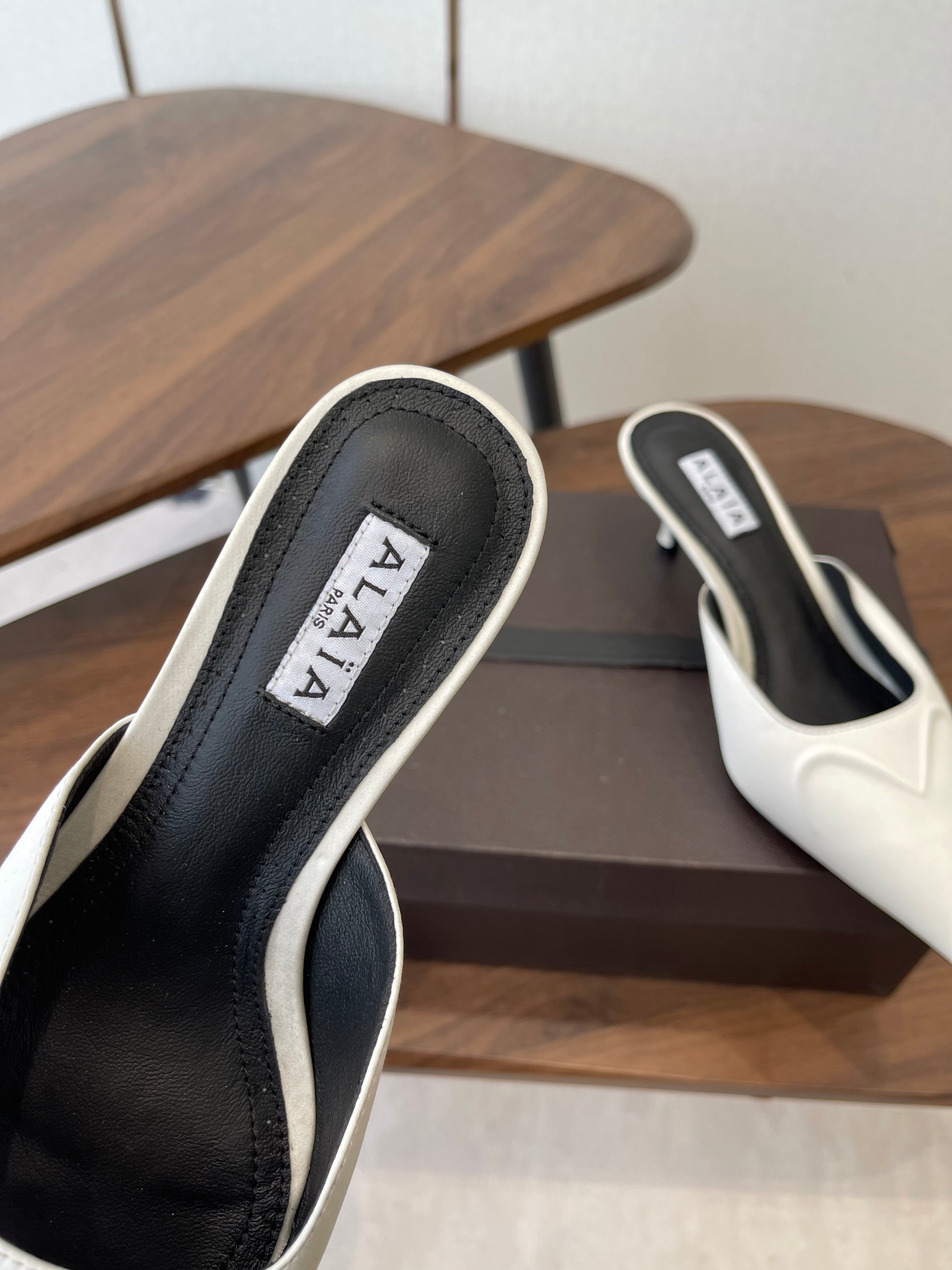 ALAIA 26S HEELED MULES 50 MM IN WHITE FABRIC