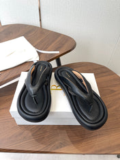 THE ROW 26S PUFFED THONG SANDALS IN BLACK CALFSKIN