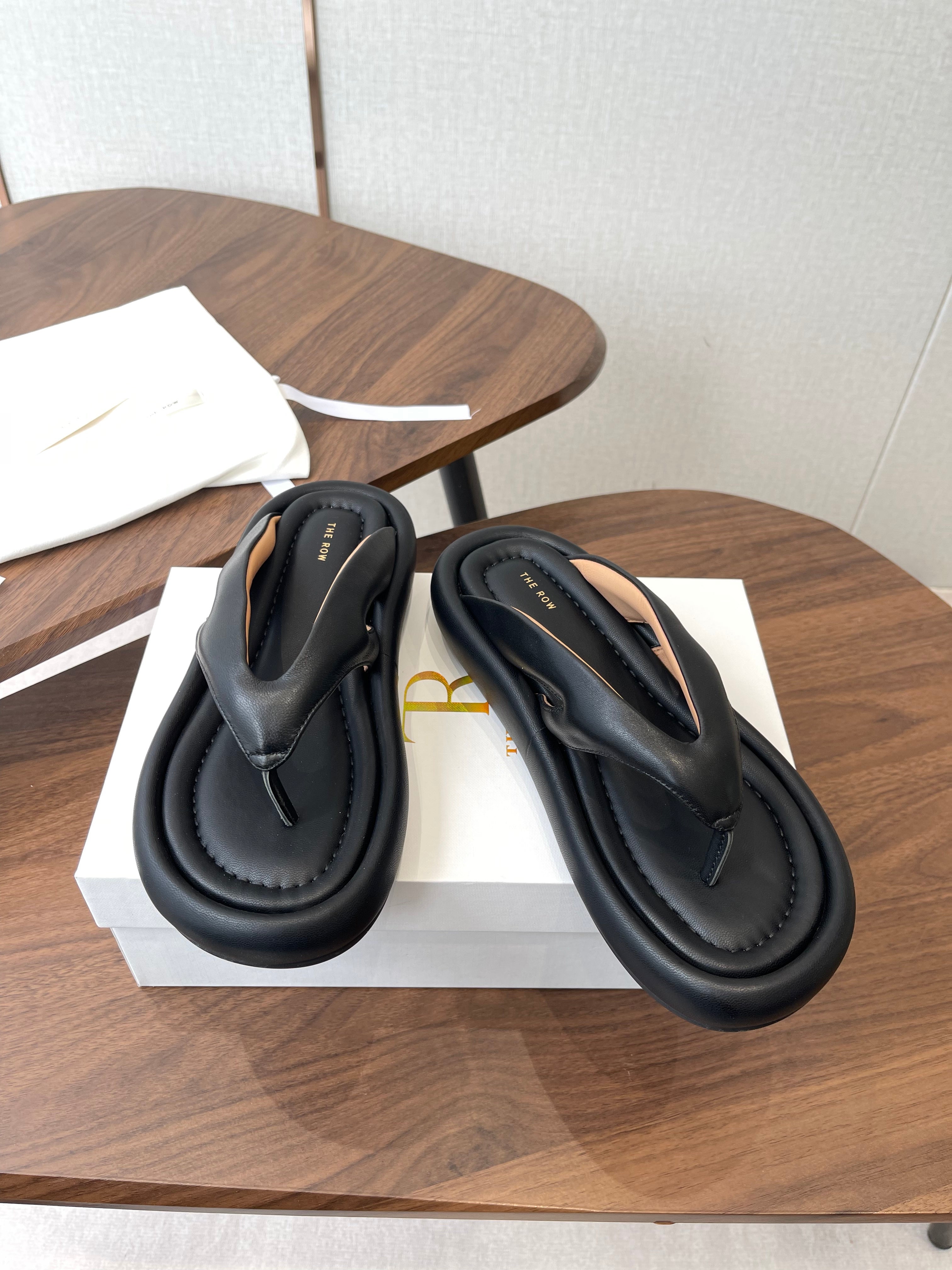 THE ROW 26S PUFFED THONG SANDALS IN BLACK CALFSKIN