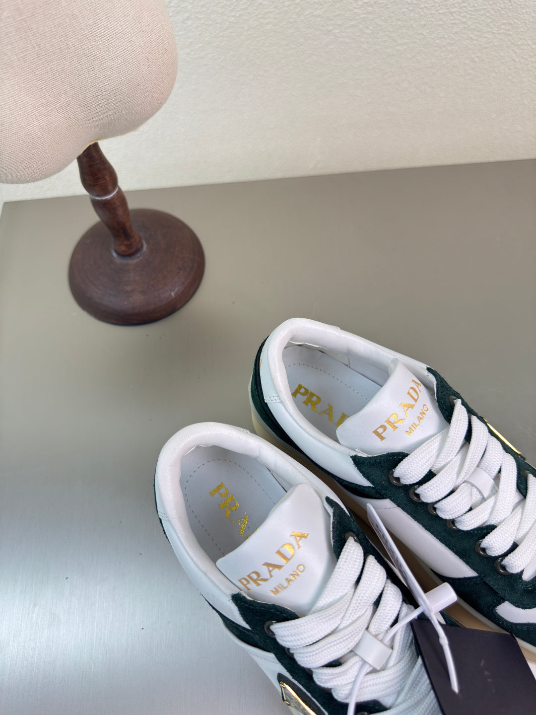 PRADA 26S DOWNTOWN THICK SOLE SNEAKERS IN WHITE CALFSKIN AND BLACK SUEDE