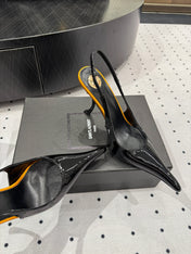 YSL 26S POINTED-TOE SLINGBACK HEELS 105 MM IN BLACK AND ORANGE PATENT CALFSKIN