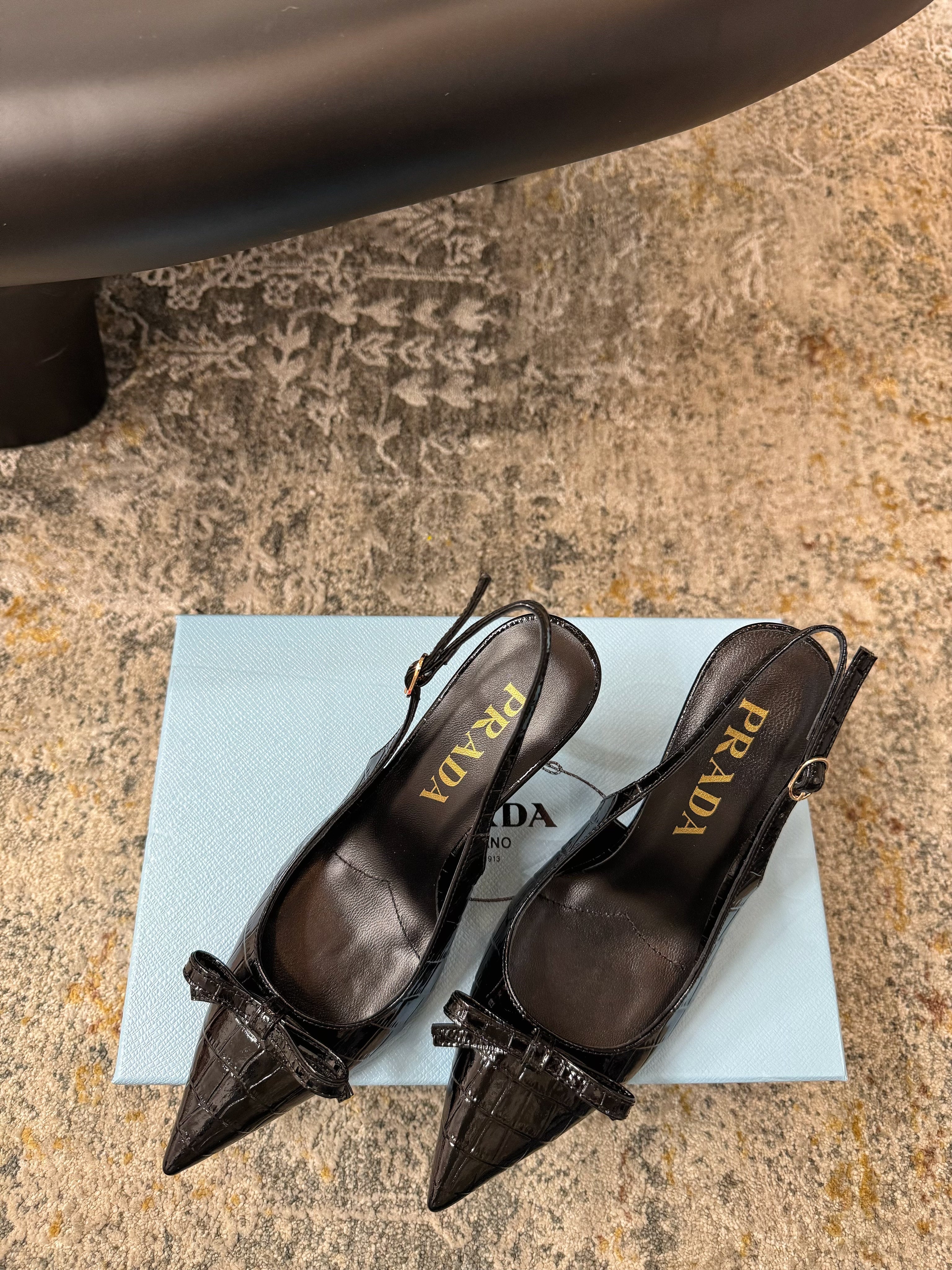 PRADA 25S SLINGBACK HIGH HEELS 75 MM IN BLACK EMBOSSED COWHIDE