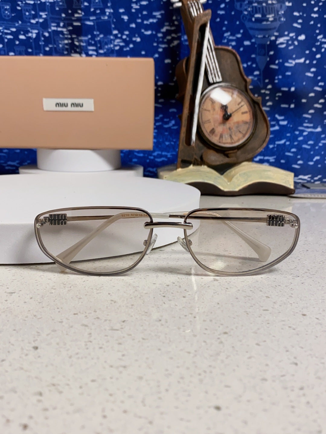 MIUMIU 26S RECTANGULAR FRAME IN METAL 426396