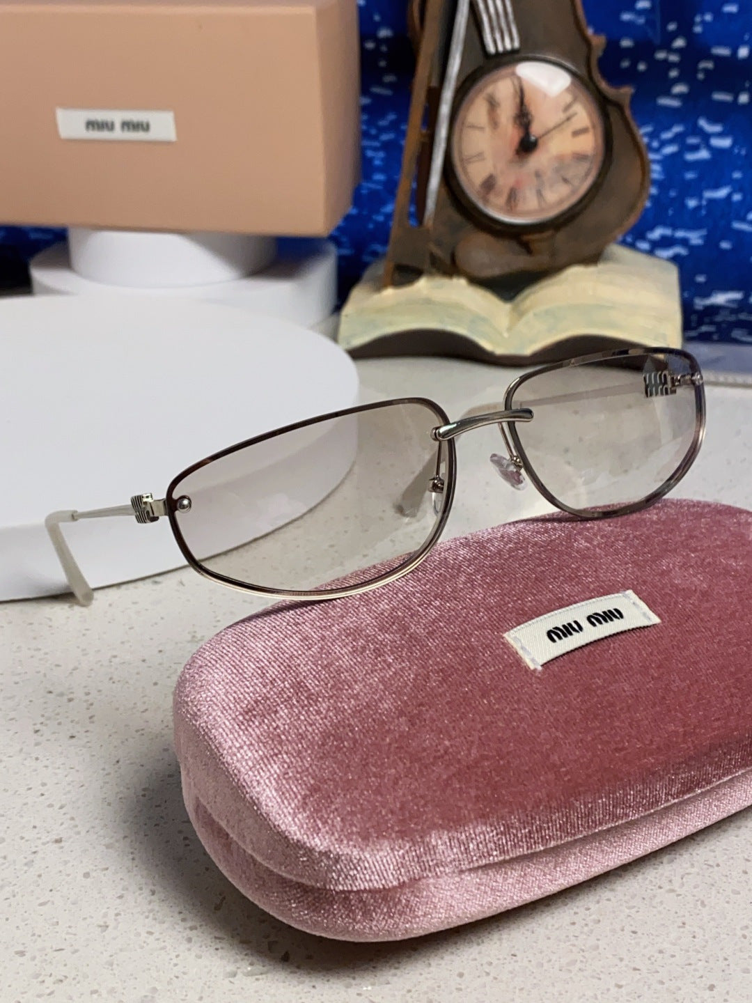 MIUMIU 26S RECTANGULAR FRAME IN METAL 426396