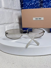 MIUMIU 26S RECTANGULAR FRAME IN METAL 426396