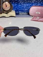 MIUMIU 26S RECTANGULAR FRAME IN METAL 426399