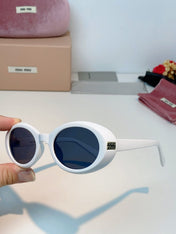 MIUMIU 26S OVAL FRAME IN ACETATE 424531