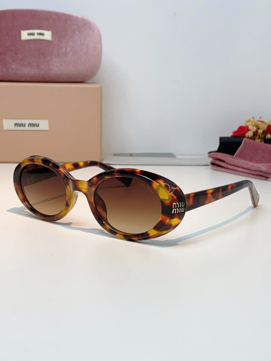 MIUMIU 26S OVAL FRAME IN ACETATE 424532