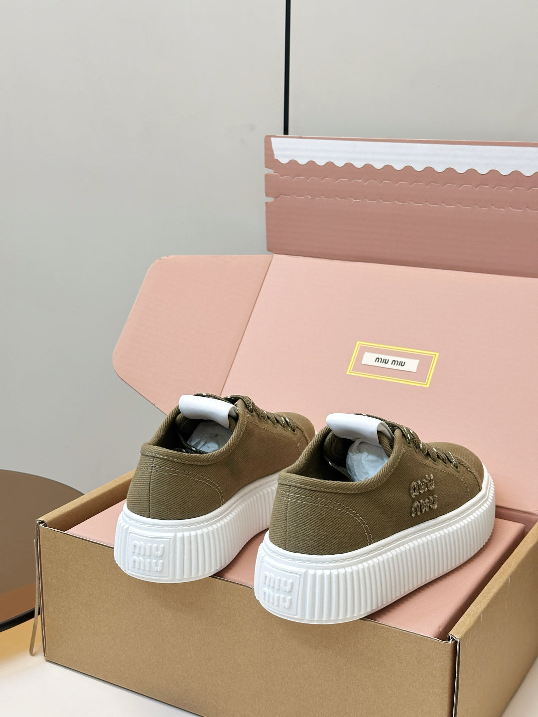 MIUMIU 26S PLATFORM SNEAKERS IN OLIVE GREEN CANVAS