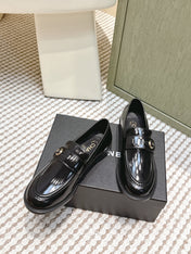 CHANEL 25S GODDESS FLAT LOAFERS IN BLACK PATENT CALFSKIN GOLD HARDWARE