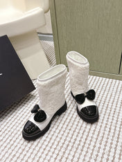 CHANEL 25S ANKLE BOOTS IN WHITE SHEARLING LAMBSKIN AND BLACK PATENT CALFSKIN