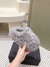 CHANEL 25S CLASSIC FURRY SLIDES IN GRAY WITH DOUBLE C LOGO