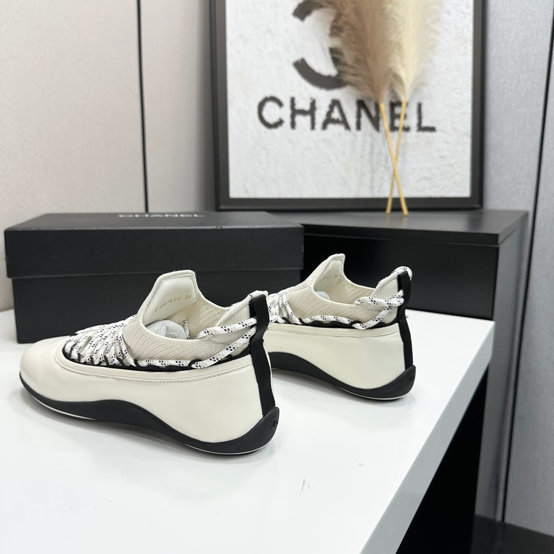CHANEL 26S SNEAKERS IN WHITE AND BLACK CALFSKIN