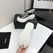 CHANEL 26S CHUNKY SNEAKERS IN BLACK AND WHITE CALFSKIN