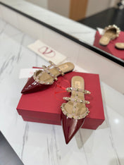 VALENTINO 26S STUDDED FLAT MULES IN DARK RED PATENT CALFSKIN
