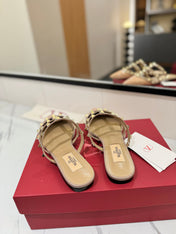 VALENTINO 26S STUDDED FLAT MULES IN BEIGE PINK PATENT CALFSKIN