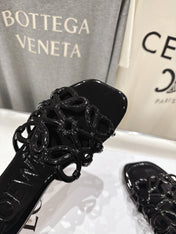 LOEWE 26S PETAL ANAGRAM SLIDE IN BLACK PATENT CALFSKIN