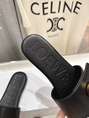 LOEWE 26S PEBBLE SLIDE IN BLACK CALFSKIN GOLD HARDWARE