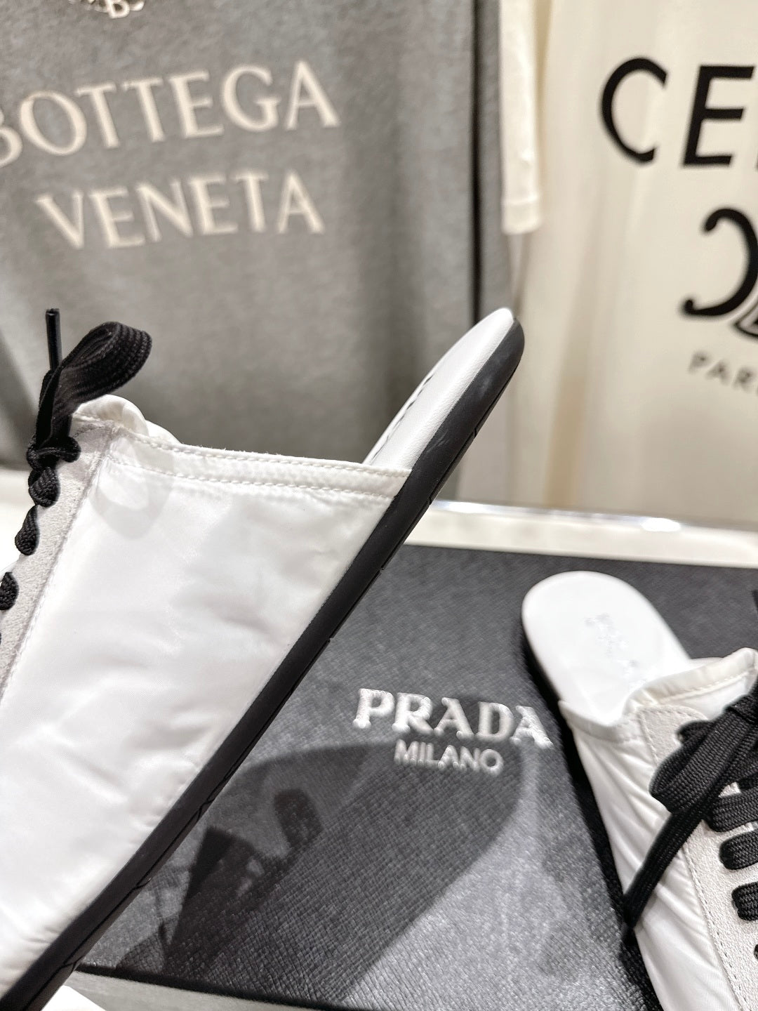 PRADA 25S MULES IN WHITE WITH METAL TOECAP