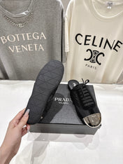 PRADA 25S MULES IN BLACK WITH METAL TOECAP