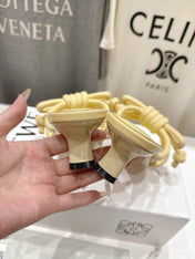 LOEWE 26S KITTEN HEEL KNOT SANDALS IN BUTTER YELLOW CALFSKIN