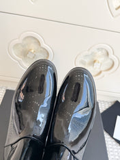 CHANEL 26S SHORT BOOTS IN BLACK PATENT LEATHER