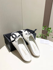 CHANEL 26S FLAT MULES IN WHITE LAMBSKIN
