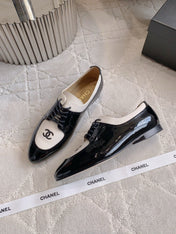 CHANEL 25S TWO TONE LACE UP IN BLACK AND WHITE SHINY CALFSKIN