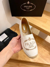PRADA 26S EMBROIDERED LOGO ESPADRILLE FLATS IN WHITE CALFSKIN