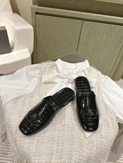 FLAT MULES IN BLACK CROCODILE EMBOSSED GLOSSY CALFSKIN