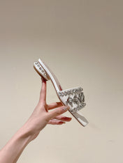 TRUMPET METALLIC MULES IN WHITE SMOOTH CALFSKIN WITH EMBELLISHED BUCKLE