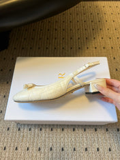 DIOR 26S OPEN BACK SANDALS IN CREAM WHITE CALFSKIN WITH PEARL BOW