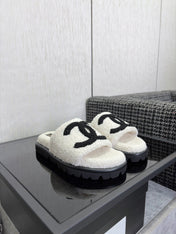 CHANEL 26S SLIDE SANDALS  IN BLACK AND WHITE SHEARLING