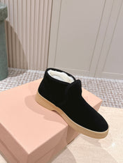 MIUMIU 25S SLIP-ON BOOTIES IN BLACK SUEDE WITH FAUX SHEARLING