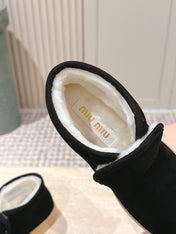 MIUMIU 25S SLIP-ON BOOTIES IN BLACK SUEDE WITH FAUX SHEARLING