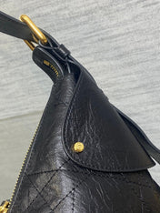 DIOR 25S SMALL VOYAGE BAG 23 IN BLACK FLAT MACROCANNAGE GRAINED GLOSSY CALFSKIN
