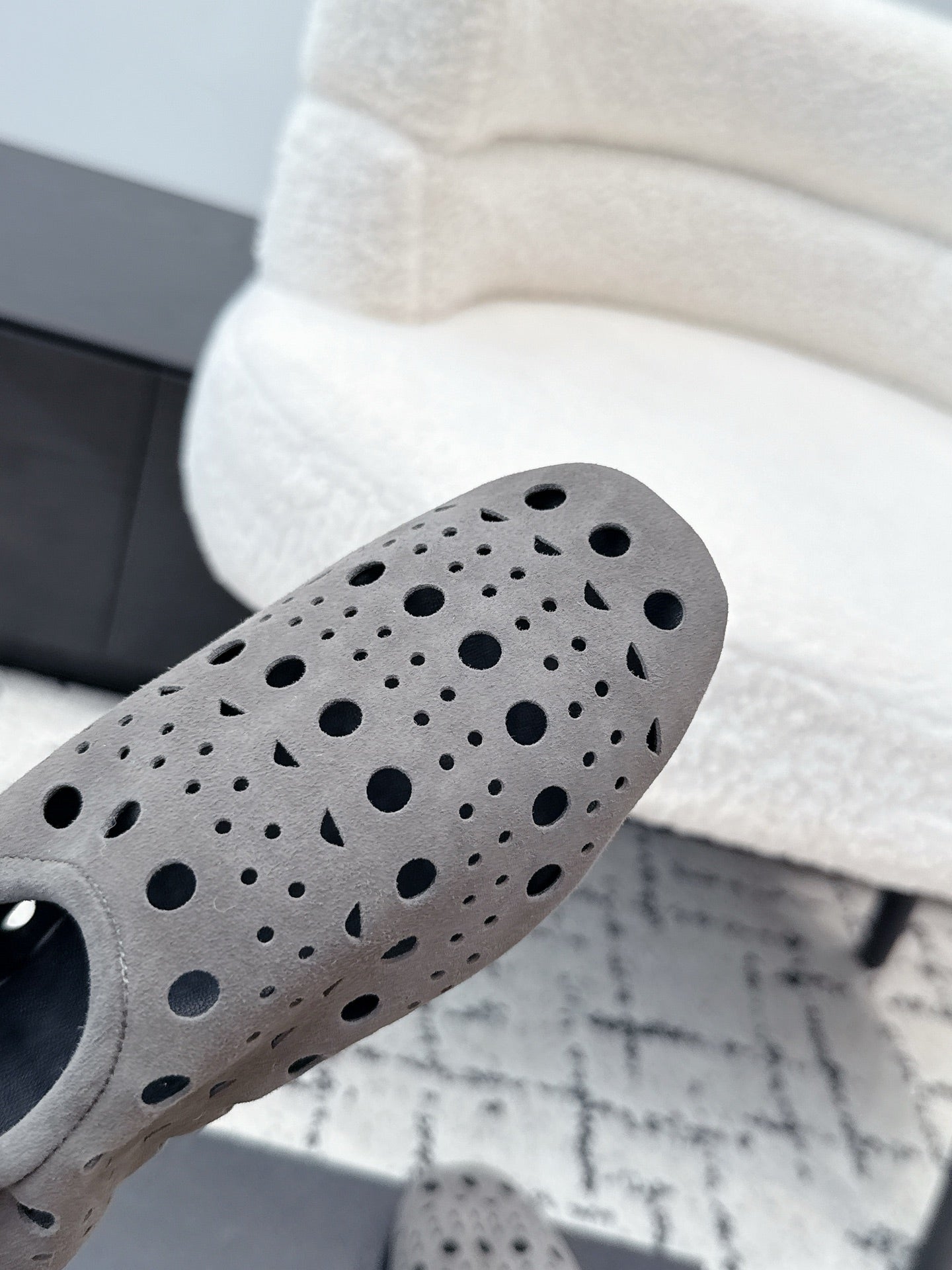 ALAIA 26S FLAT SLIP-ONS IN GREY SUEDE WITH OPENWORK PATTERN
