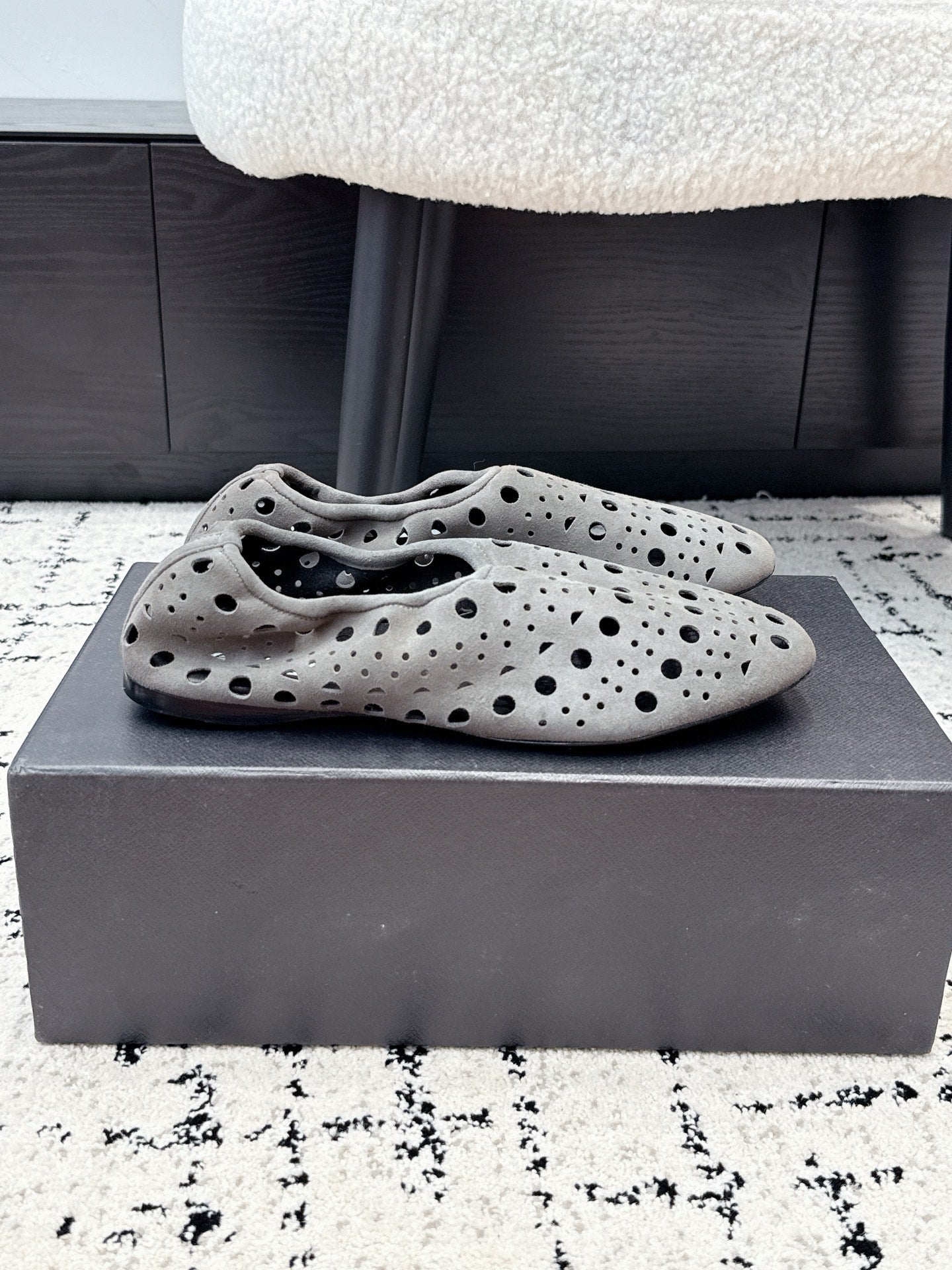ALAIA 26S FLAT SLIP-ONS IN GREY SUEDE WITH OPENWORK PATTERN